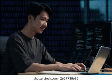 Hacking and malware concept. Hacker using abstract laptop with binary code digital interface. 