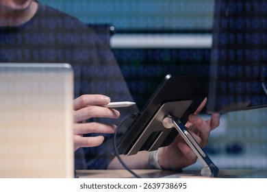 Hacking and malware concept. Hacker using abstract laptop with binary code digital interface. 