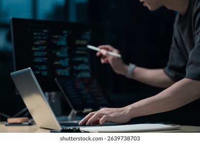 Hacking and malware concept. Hacker using abstract laptop with binary code digital interface. 