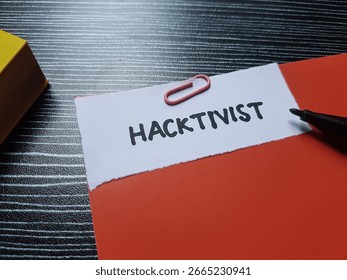 Hacktivist writting on table background.