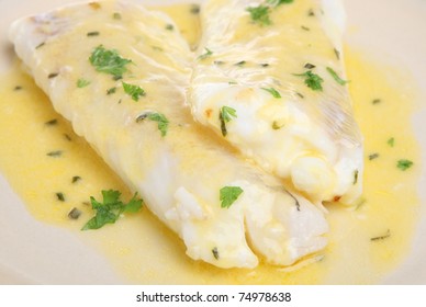 Haddock Fillets In A Lemon And Herb Sauce.