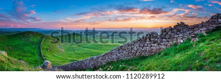 Hadrian's Wall Panorama at Sunset, a World Heritage Site in the beautiful Northumberland National Park. Popular with walkers along the Hadrian's Wall Path and Pennine Way