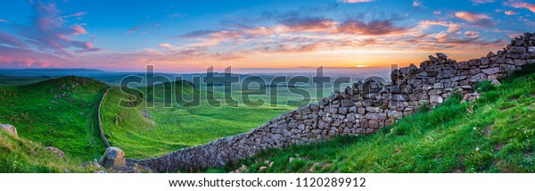 Hadrian\'s Wall\
Panorama at Sunset, a World Heritage Site in the beautiful\
Northumberland National Park. Popular with walkers along the\
Hadrian\'s Wall Path and Pennine\
Way