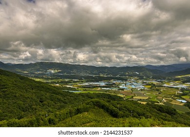 Haean-myeon, Yanggu-gun, Gangwon-do, South Korea - September 16, 2021: Aerial And Summer View Of Mountain Ridge And Farming Villages With Houses And Field Near DMZ At Punch Bowl Basin
