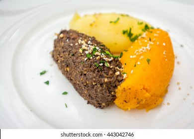 Haggis Is A Traditional Scottish Dish. It Is A Savoury Pudding Containing Animal's Pluck (heart, Liver And Lungs), Commonly Served With Neeps, And Tatties. The Animal Can Be Sheep Or Venison.