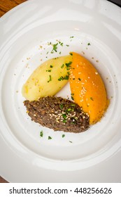 Haggis Is A Traditional Scottish Dish. It Is A Savoury Pudding Containing Animal's Pluck (heart, Liver And Lungs), Commonly Served With Neeps, And Tatties. The Animal Can Be Sheep Or Venison.