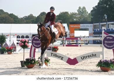 THE HAGUE, HOLLAND - AUGUST 31, 2008: Concours Hippique. Horse clearing a hurdle at the annual horse jumping competition at Westbroek Park.