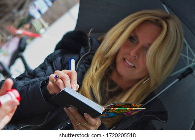 The Hague, Netherlands - 09 June 2010 : Blond Caucasian Dutch Sax Ophone Musician Candy Dulfer Giving Autograph To Fan