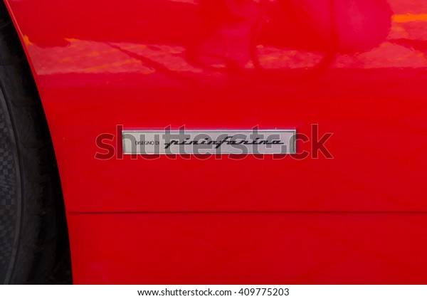 The Hague , the Netherlands - April\
21, 2016: Car designer badge on red Ferrari front\
fender