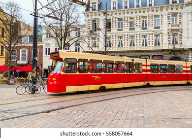 Hague, Netherlands - April 5, 2016: Red Tram And Dutch Traditional Houses On Background In Den Haag, Holland