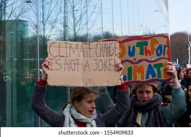 The Hague, The Netherlands - February 7, 2019: Youth/student strike for climate, protest against climate change. Sign reading: Youth for climate! Climate change is not a joke!
