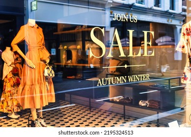 The Hague, Netherlands - January 03 2022: A Sale Sign Sticker Is Affixed To The Front Window Of A Retail Store In Main Street Downtown Indicating Discounts Available