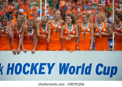 THE HAGUE, NETHERLANDS - JUNE 14: The Netherlands Women Field Hockey Team Celebrates On The Podium During The Prize Winning Ceremony After Beating Australia And Becoming World Champions For 2014