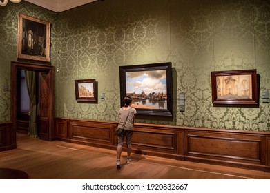 The Hague, Netherlands - June 25, 2019: A Girl Examining A Dutch Golden Age Painting At The Mauritshuis Art Museum In The Hague, Western Netherlands