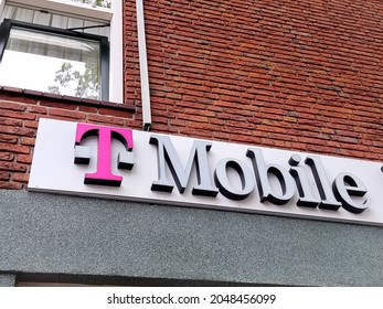 The Hague, The Netherlands - September 27 2021:Sign T Mobile Logo On Local Dutch Shop In Holland. T-mobile Is A German Telecommunications Operator,providing Wireless Mobile Phone And Internet Services