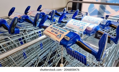 The Hague, The Netherlands - September 8 2021: Aldi supermarket basket shopping cart with Aldi logo, blue shopping trolley for customers doing grocery for daily household in Dutch city The Hague. 