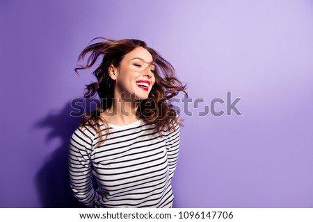 Ha-ha! Portrait with copy space empty place of cheerful laughter funny comic girl having flying hair isolated on violent background, enjoying wind flow