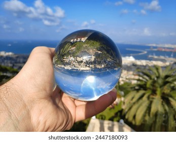 Haifa city glass sphere reflection in Israel. Cityscape of Haifa with Bahai Gardens. - Powered by Shutterstock