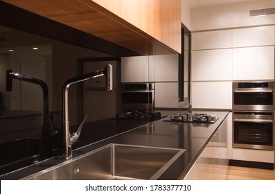 Haifa / Israel - Apr 27 2014:  Modern Light Grey  Kitchen With Island And Oak Cabinets 