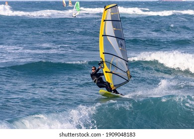 Haifa, Israel -  JAN  30 2021 :  windsurfers in a winter storm
