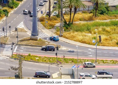 Haifa, Israel - May 04, 2022: Road scene with people standing still near their cars for the sound of siren, on the national annual Memorial Day (war and terror casualties), in Haifa, Israel