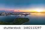 Haikou Cityscape in the Marina Bay Binhai Avenue CBD Area, with Landmark Buildings and Evergreen Park View During Sunset, Hainan Province, China. Aerial View.