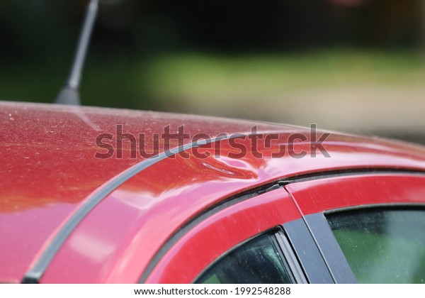 Hail damage at car, storm, damage,\
thunderstorm, Dented car after a major hail\
storm\
