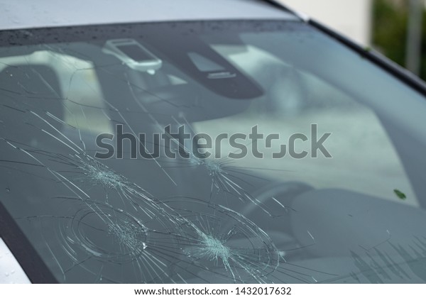 Hail\
damage to front window after a severe\
thunderstorm
