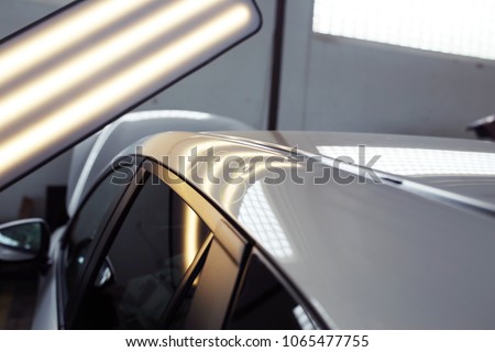hail damage on a car, lights for detecting dents in a car body