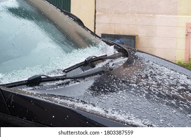 Hail Falling On The Windshield Of A Car During Winter