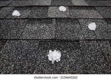 Hail in on roof after hailstorm, shallow focus on hail in the foreground