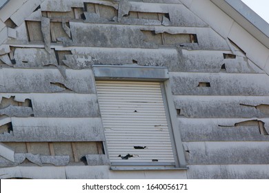 Hail And Storm Damage At House Wall, Stormy Weather, Holes In Exterior Siding In Home From Damage By Hail Storm , Climate Change, Danger