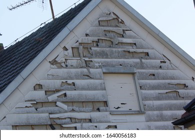 Hail And Storm Damage At House Wall, Stormy Weather, Holes In Exterior Siding In Home From Damage By Hail Storm , Climate Change, Danger