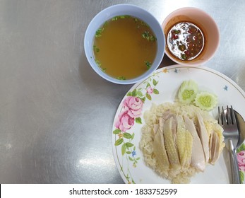 Hainanese Chicken Rice On A Stainless Steel Table