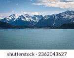 Haines, Alaska with several small cruise ships in port, near Glacier Bay National Park and Preserve. Takshanuk Mountains (Mount Ripinsky and other peaks) in the background.