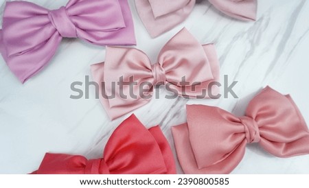 Hair bow made out of satin fabric in beautiful color. This beautiful bow with unique design is a great hair accessory.