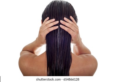 Hair care concept. Back view of woman with long wet hair, white background