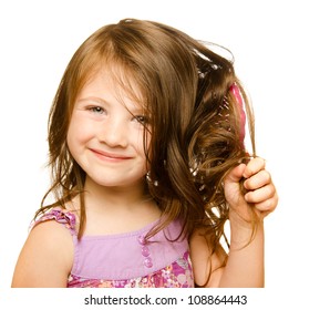 Hair care concept with portrait of girl brushing her unruly, tangled long hair isolated on white - Powered by Shutterstock