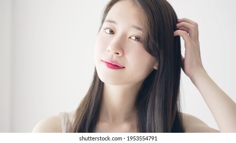 Hair Care Concept Of Young Asian Woman.