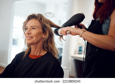 Hair care, hairdresser and senior woman client hair treatment, professional salon service and hairdryer. Small business, elderly female and brush modern hairstyle, happy customer and beautician lady.