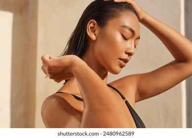 Hair Care. Woman Enjoying Sunlight With Closed Eyes, Relaxed Expression, And Wet Hair, Embracing Natural Beauty. - Powered by Shutterstock