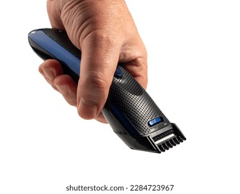 Hair clipper in hand isolated on white background. Modern hair clipper. Close-up. - Powered by Shutterstock