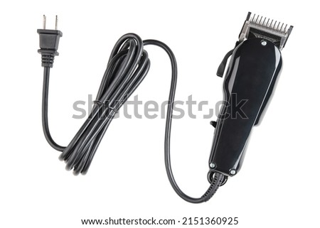 Hair clipper. Professional barber hair clipper for haircut. Hairdresser salon equipment. Premium hairdressing Accessories. Top view on corded electric black hair clipper isolated on white background.
