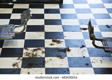 Hair Clippings On The Checkered Floor Of An Old Barbershop In San Diego, CA.