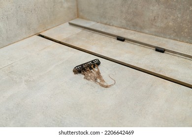 Hair Clogs Shower Drain. Removing Hair Clump From The Shower Drain.