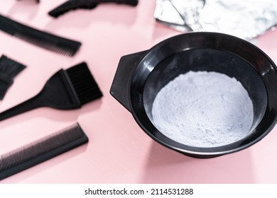 Hair Color Dye Powder In A Black Plastic Mixing Bowl On A Pink Background.