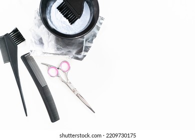 Hair Color Dye Powder In A Black Plastic Mixing Bowl On A White Background.