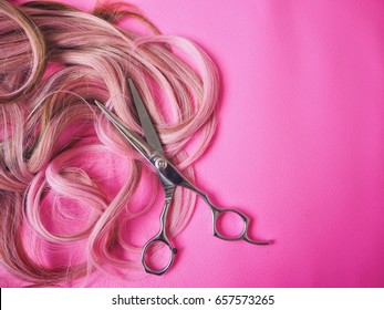 Hair cutting shears on pink background - Powered by Shutterstock