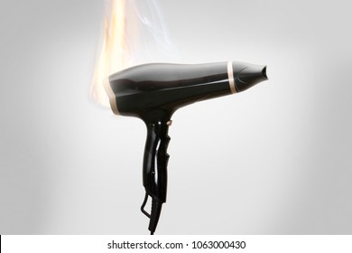 
hair dryer on fire - Shutterstock ID 1063000430