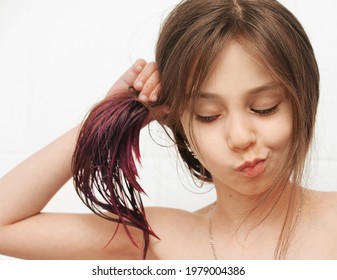 Hair Dyeing At Home. Children Have Their Hair Dyed In Trendy Pink Color At Home 